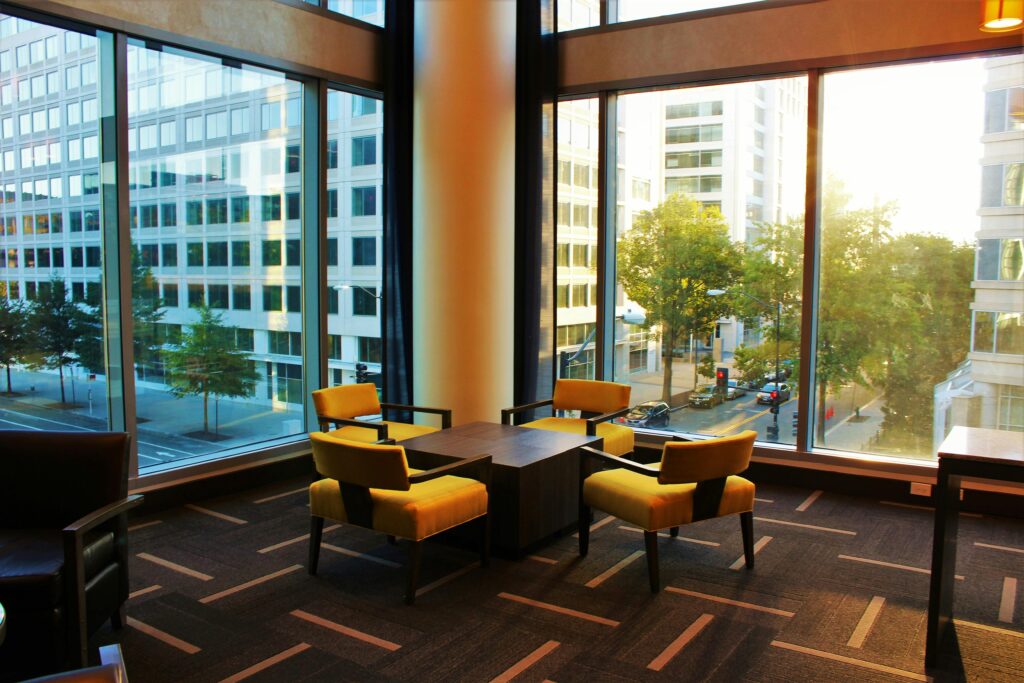 Brown Coffee Table Surrounded by Four Chairs